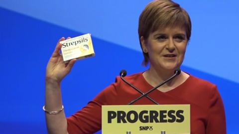 Nicola Sturgeon with throat sweets