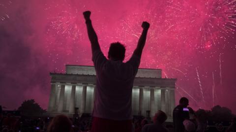 A fireworks display follows the "Salute to America" ceremony in front of the Lincoln Memorial