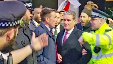 Sir Keir Starmer protected by police