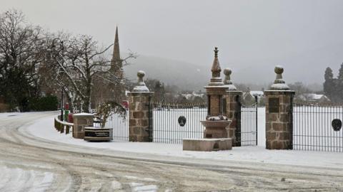 Snow covered trees and urban park in Aboyne