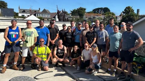 Twenty-four of the team of volunteers in Samantha's garden