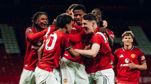  Chido Obi-Martin of Manchester United celebrates scoring a goal to make the score 2-1 with his team-mates during the FA Youth Cup Semi Final match between Manchester United and Crystal Palace at Old Trafford