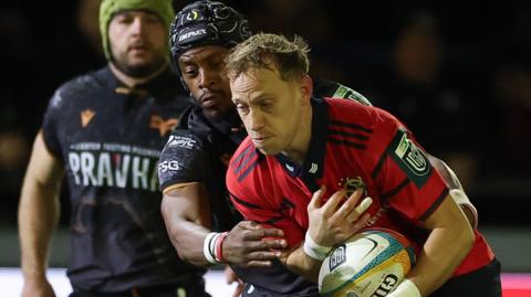 Mike Haley is tackle by Daniel Kasende