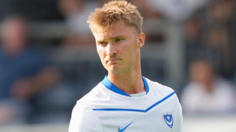 Thomas Waddingham wearing Portsmouth's white away kit during a pre-season friendly against Wycombe Wanderers at Adams Park on 25 July