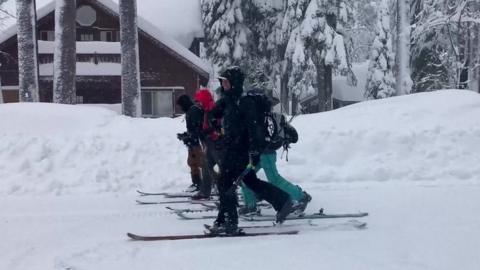 People walk on skis in California