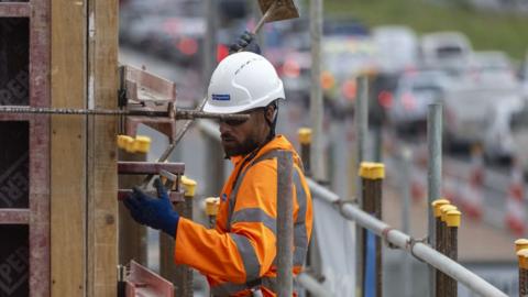A man carries out roadworks