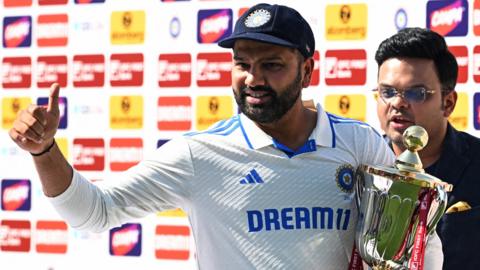 India captain Rohit Sharma celebrates with the trophy after his side seal a 4-1 Test series win over England