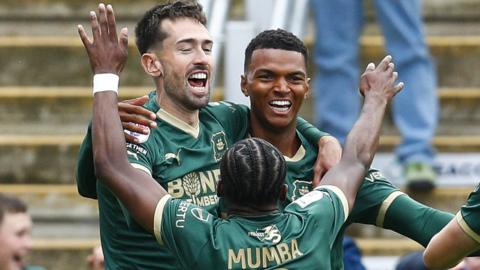 Ryan Hardie, Morgan Whittaker and Bali Mumba celebrate a Plymouth Argyle goal