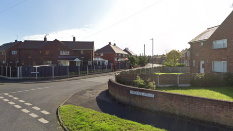 An exterior shot of a Doncaster suburb with red houses and greenerey 