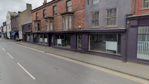The exterior of the former Curzon cinema in Ripon, which is painted purple.