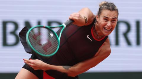 Aryna Sabalenka hits a serve