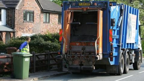 Refuse lorry collecting bin in Cheshire
