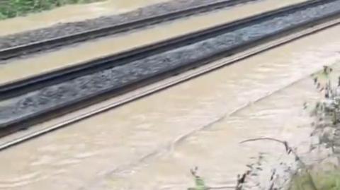 Water overflowing from train tracks