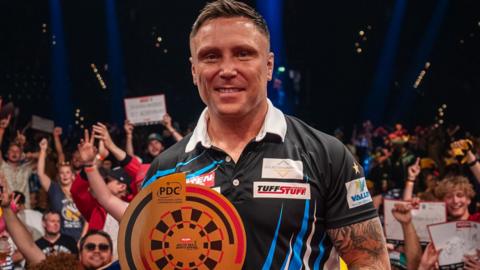 Gerwyn Price holds the Baltic Sea Darts Open trophy