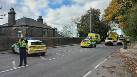 Police attend the scene of a crash in Leeds