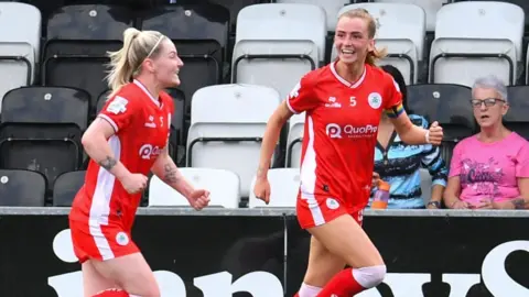 Caitlin McGuinnness celebrates