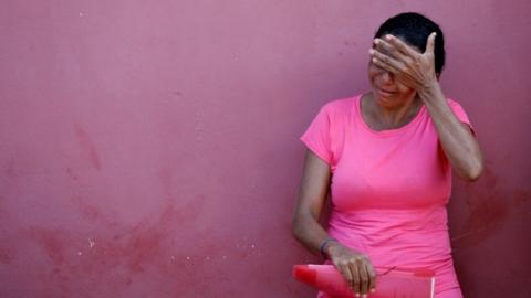 A relative of a prisoner cries after a prison riot, in front of the Medical Legal Institute of Altamira, Brazil, July 30, 2019.