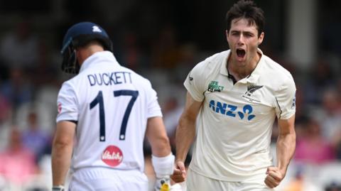 New Zealand fast bowler Will O'Rourke (right) celebrates taking the wicket of England batter Ben Duckett (left)
