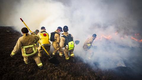 Firefighters tackling the fire on Saturday