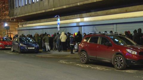 Queue of people waiting for food in Grimston Street, Hull
