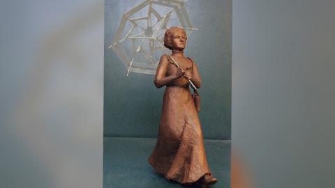 A maquette statue of Amy Walmsley