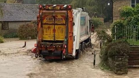 The bin lorry in floodwater in Diddlebury