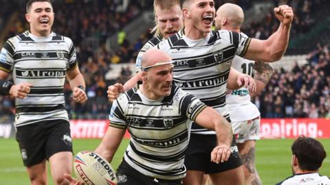 Danny Houghton and his Hull FC team-mates celebrate his try