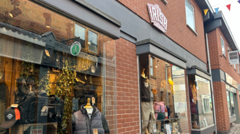 A shop window, with with clothes in display