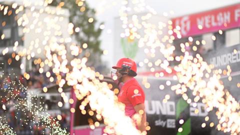 Welsh Fire player takes to the field amidst pyrotechnics