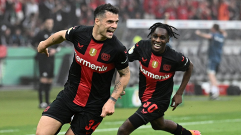 Bayer Leverkusen celebrate scoring a goal through Granit Xhaka