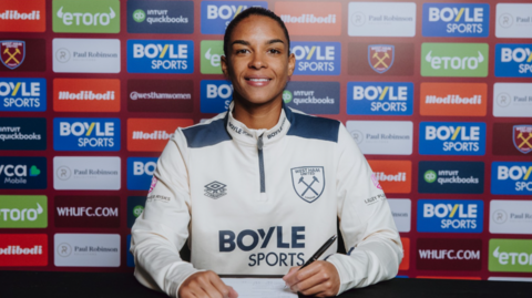 Estelle Cascarino poses for a photo signing her West Ham contract