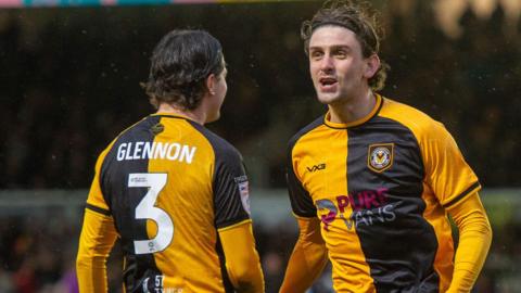 Harrison Biggins of Newport County celebrates scoring a goal