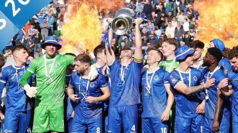 Dungannon Swifts captain Dean Curry lifts the Irish Cup