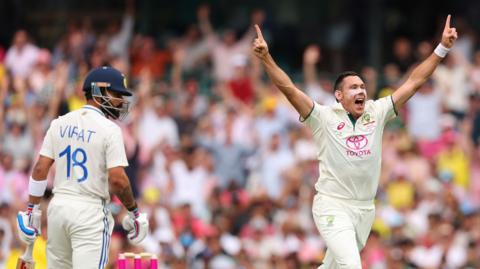 Scott Boland celebrates 