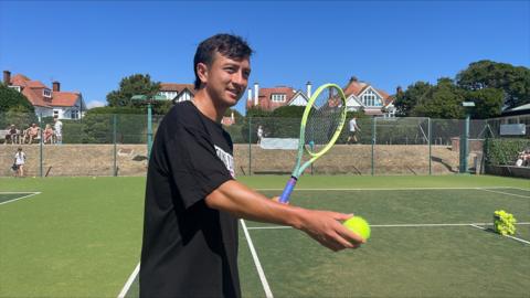 Tennis professional Ryan Peniston in action at Thorpe Bay Tennis Club in Southend