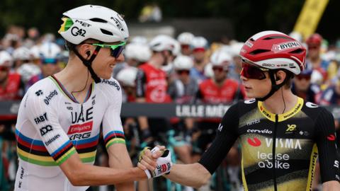 Tadej Pogacar and Jonas Vingegaard shake hands before the start of stage one of the 2025 Tour de France