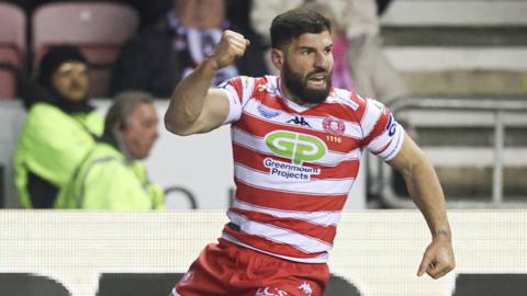 Abbas Miski celebrates his try for Wigan against Penrith