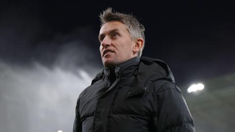 A close-up of Ipswich Town boss Kieran McKenna in a black jacket