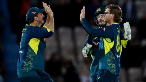 Australia players celebrate a wicket