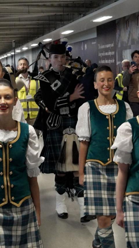 Piper and Highland dancers