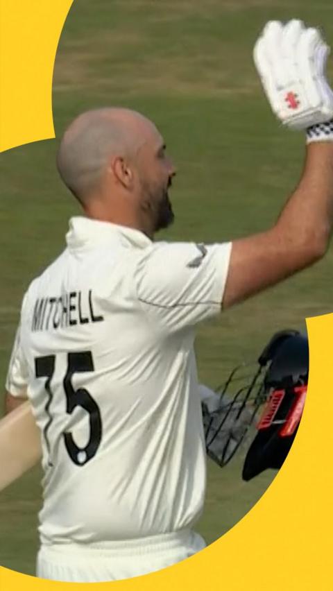 Daryl Mitchell waves to the crowd after hitting a century on day four of England v New Zealand.
