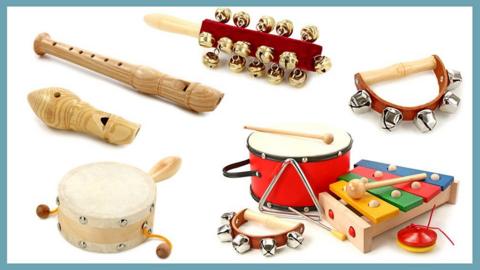 A series of instruments commonly found in Primary school classrooms - shakers, drums, recorders and a xylophone.