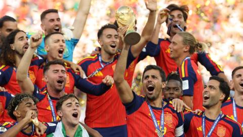 Spain lift World Cup trophy