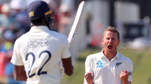 New Zealand bowler Neil Wagner (right) celebrates the dismissal of England's Jofra Archer (left)