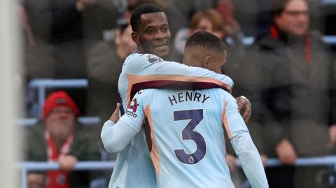 Dango Ouattara and Rico Henry celebrate during Brentford's win at Aston Villa