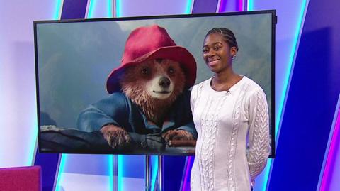 Shanequa in the studio with Paddington in the screen