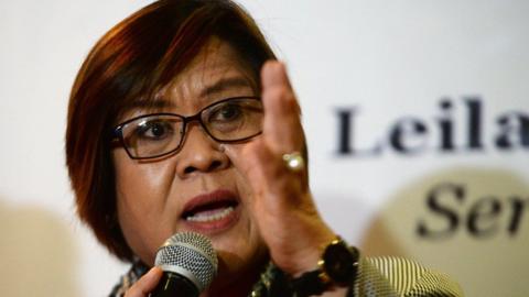 Former justice secretary and human rights chief Senator Leila de Lima gestures during a press conference in Manila on 7 November 2016 after filing her petition for habeas data against Philippine President Rodrigo Duterte.