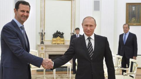 Russian President Vladimir Putin shakes hands with Syrian President Bashar al-Assad at the Kremlin in Moscow (20 October 2015)