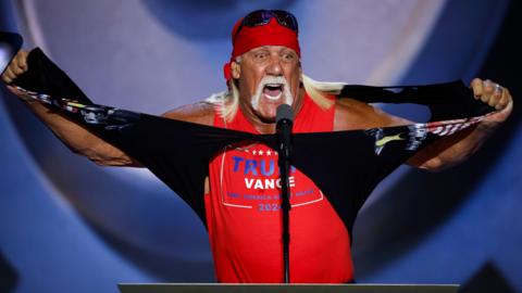 Professional entertainer and wrestler Hulk Hogan rips his shirt as he speaks on stage at the Republican National Convention in Milwaukee