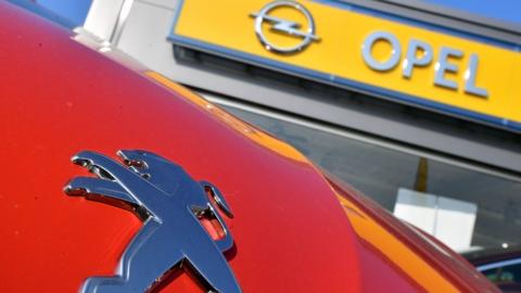 Peugeot and Opel logos